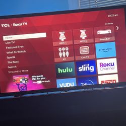 TCL Roku smart tv with soundbar and subwoofer