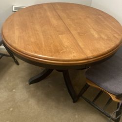 Solid oak dining room table with 3 chairs