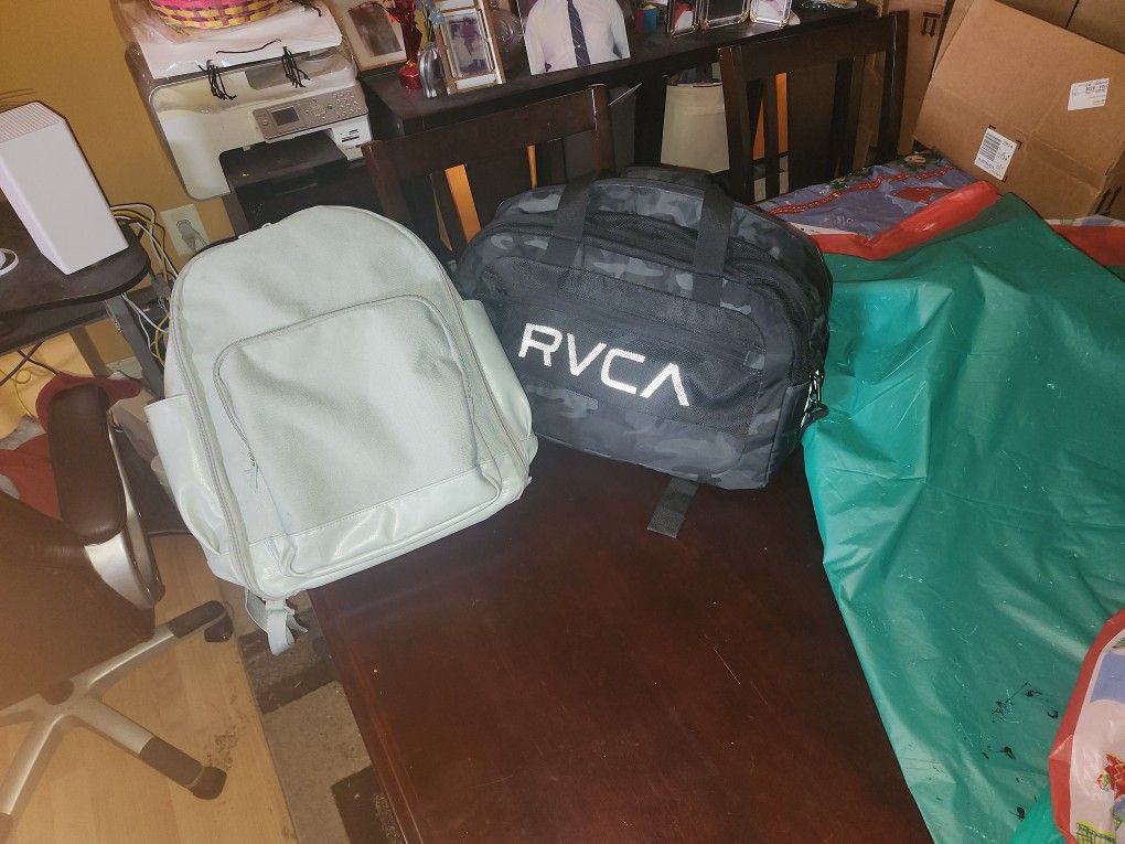 DUAL TOP OF THE LINE DUFFEL BAG AND BOOK BAG.