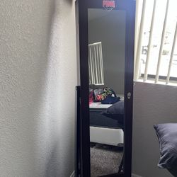 Mirror with jewelry organizer 
