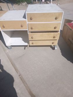 mobile storage unit featuring a white frame with natural wood drawers and wheels.