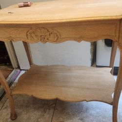 Small antiques style table with flower accents