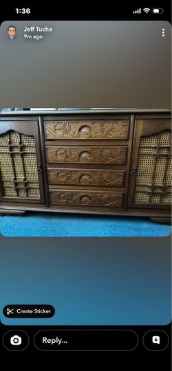 Asian dresser  hand carved(2 door ,4 drawer)  $200.00