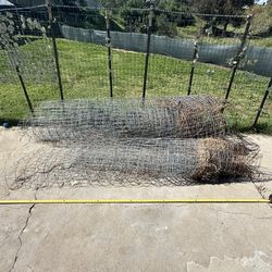 Two large free rolls of steel wire fencing