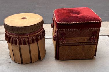 Two  Bombay Company tufted vintage ottoman featuring red and gold fabric with tassels and fringe. Vanity Bathroom or dressing