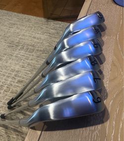 PXG Black Ops irons. Lightning 5 hybrid.