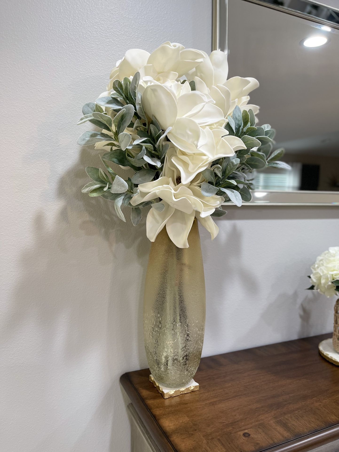 Vase with artificial flowers..