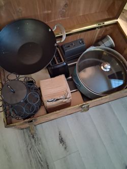 Chest with Two 14 in Skillets, 3 New Plates, Box of New Cups and Saucers,  Used toaster, and surround sound speakers