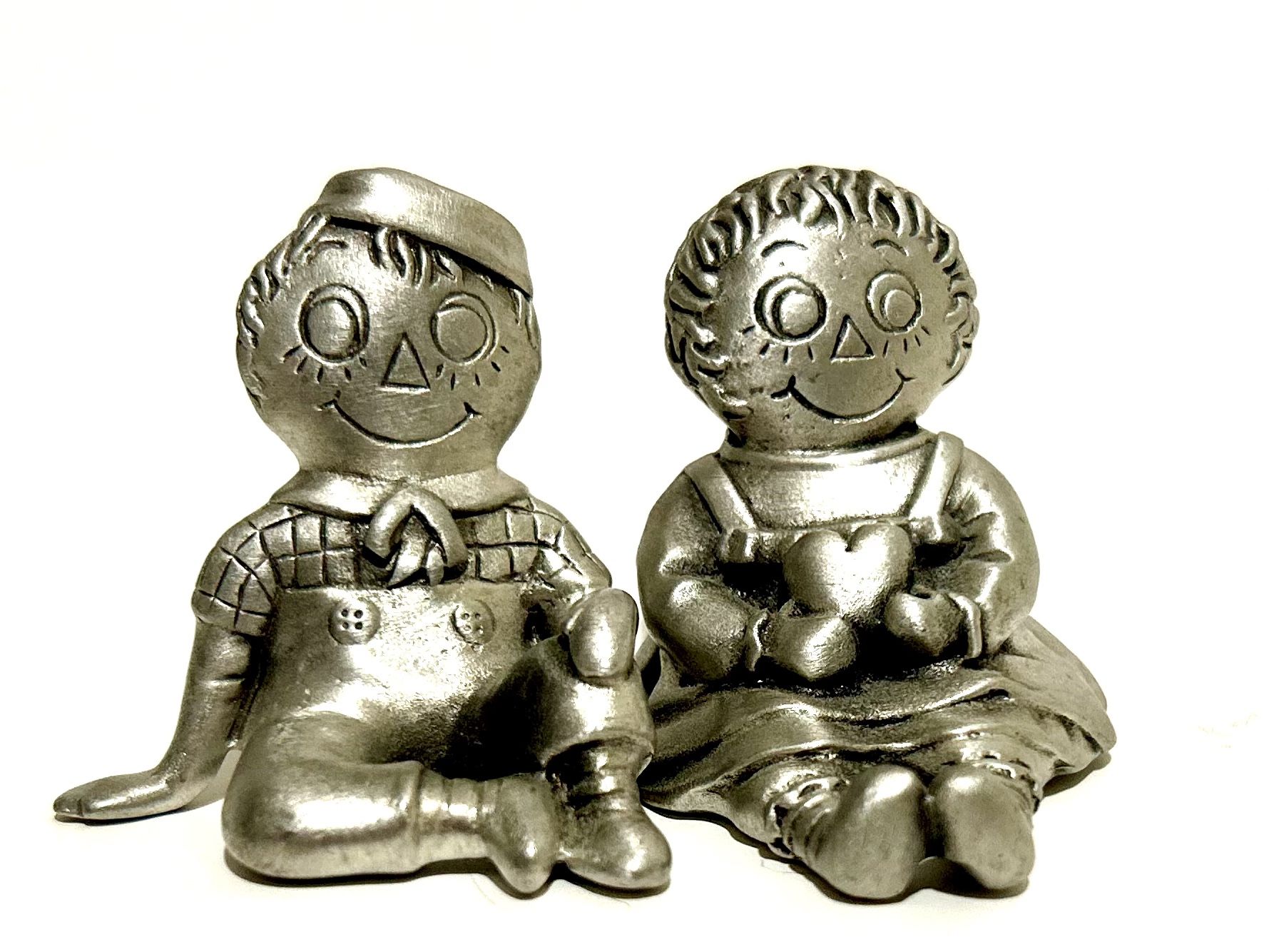 vintage metal Raggedy Ann and Andy figurines,