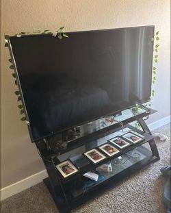 65 inch smart tv with black glass tv stand