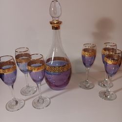 ANTIQUE PURPLE & GOLD ITALIAN GLASS DECANTER W/TOP
Antique PURPLE BLUE italian glass bottle with glass stopper. Gold ornate band around