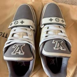 Louis Vuitton trainer with snake skin texture and Velcro fasteners
