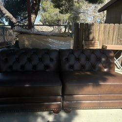 BROWN LEATHER ARMLESS SOFAS