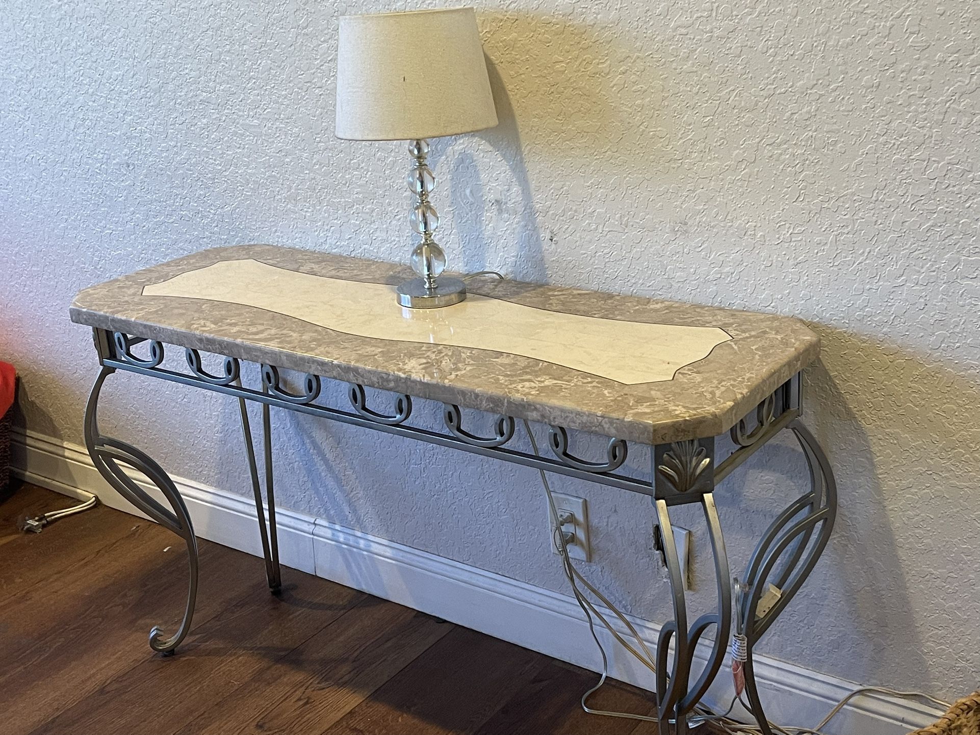 Beautiful entry or console are behind the sofa table