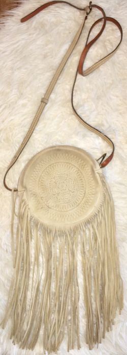 Patricia Nash small boho Fringe purse with tassels purse retails for 130 selling for $50 firm great condition shows minor discoloring from my jeans b