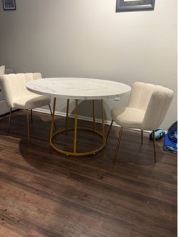 Gold and white marble table and chairs