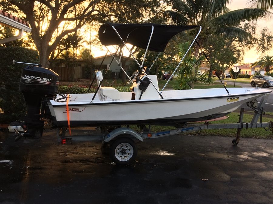 15’ Boston Whaler boat with 90 Mercury engine and trailer