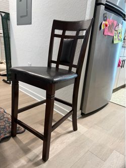 Four dining chairs / barstools