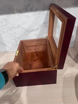 Wooden and glass box red color on the outside empties box for any storage or craft