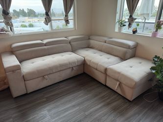 Beige Sectional with pull out bed &storage ottoman