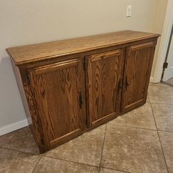Oak cabinet 3 doors with shelves midway inside