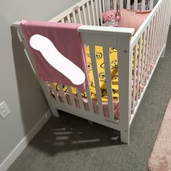 white baby crib 