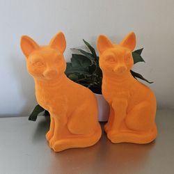 2 Neon orange Halloween cats decor Velour feel and lightweight approximately 11 1/2"h x 5 1/2"l x 4"w
you can drill a hole in the bottom and put sand 