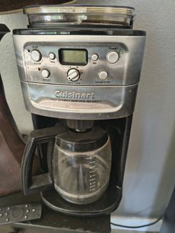 Cofee machine grinds cofee on top