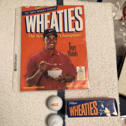 Tiger Woods Wheaties Box and signed balls with that has autograph on balls.