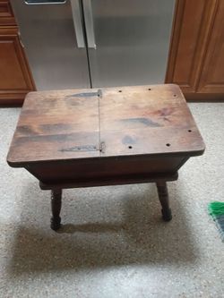 Antique small table ,with a swing door that has storage space