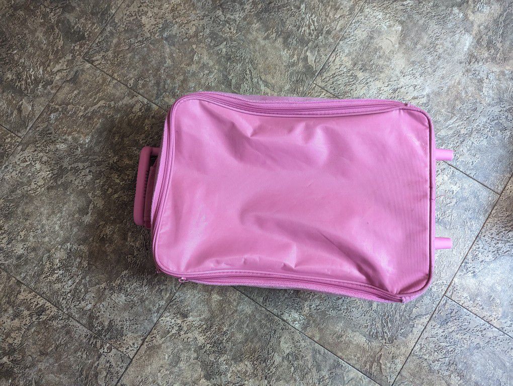 kids Carry on luggage. Pink. Can fit a few days of clothing when traveling.