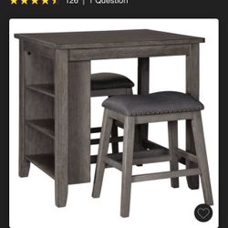 Ashley’s Caitbrook Counter high Dining Table With 4 Chairs