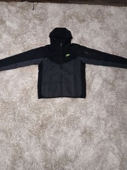 Black and green Nike tech