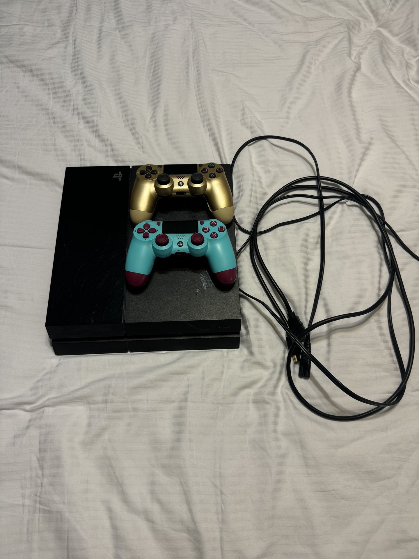 PS4 w cables and 2 remotes 