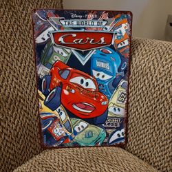 DISNEY "CARS" METAL SIGN.  12" X 8".  NEW.  PICKUP ONLY.