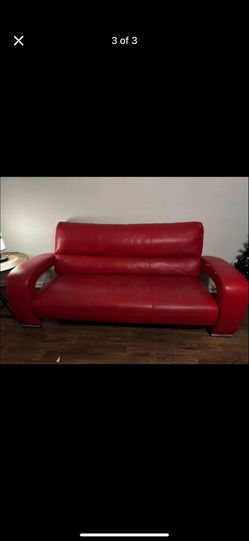 Red leather sofa set and Samsung Curve TV