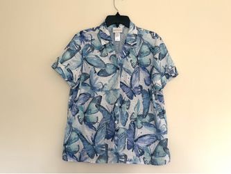 Alfred Dunner short-sleeve blouse features a blue butterfly print and button-up closure