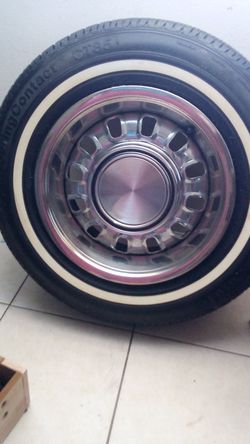 classic 1968–1969 Ford Styled Steel Wheel mounted on a vintage whitewall tire.