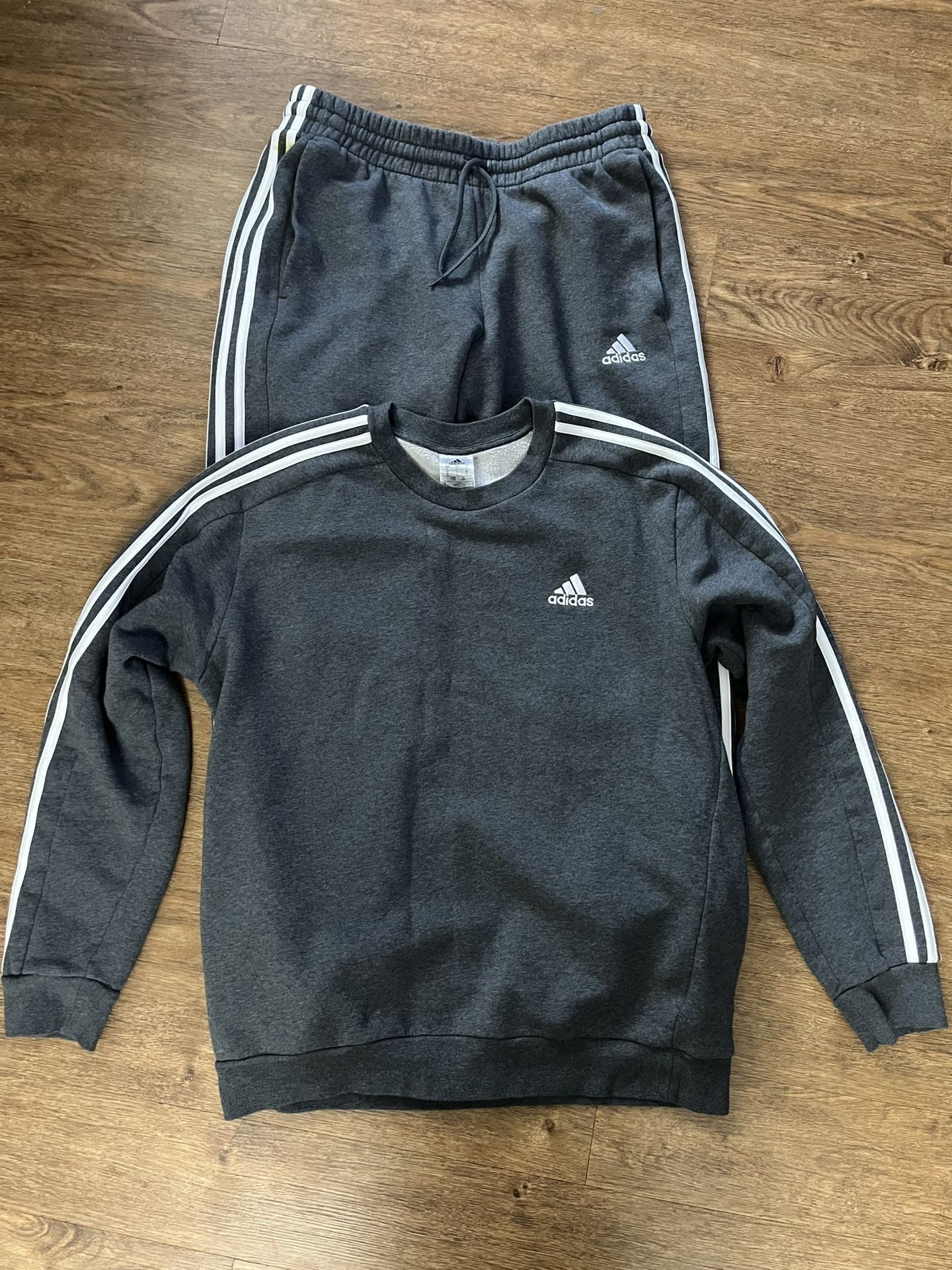 Grey Adidas tracksuit.