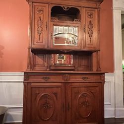 Antique Carved French Buffet Cabinet in Oak—Great Condition Gorgeous Details. Plate rack. Mirror door. Three upset cabinets with shelving. Two drawers