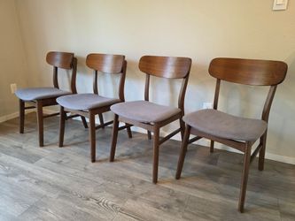 4 Brown Wooden Chairs With Gray Upholstery