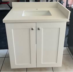 Bathroom vanity cabinet with sink and countertop