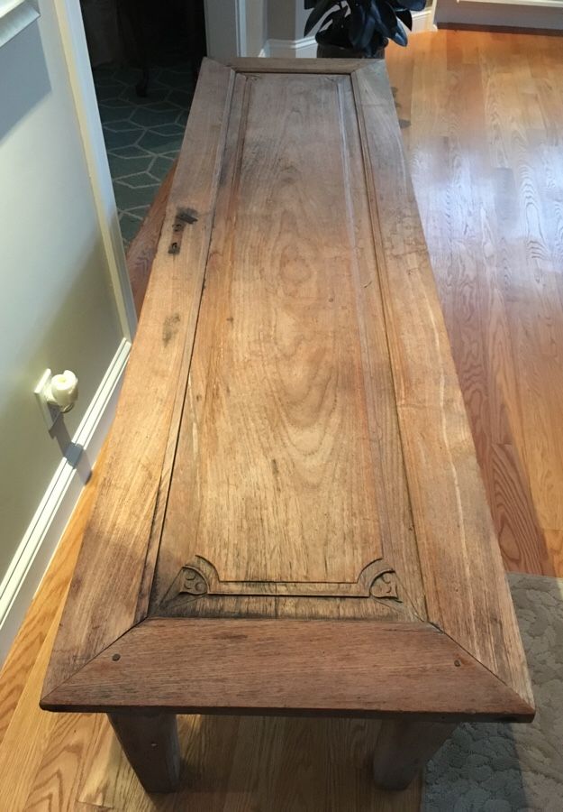 Antique oak door with carved detail and key hole converted to a table makes a great conversation piece. $350.00