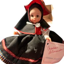 Madame Alexander doll, specifically the "Peru" doll from the International Series, which was made between 1950 and 1960. The doll is an 8-inch represe