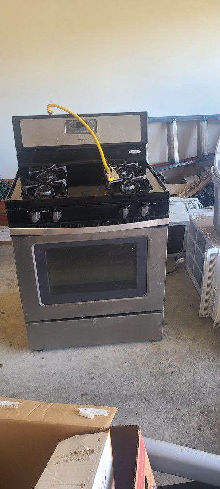 Black and stainless steel Whirlpool gas stove