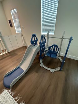 Kids play gym with slide and swing