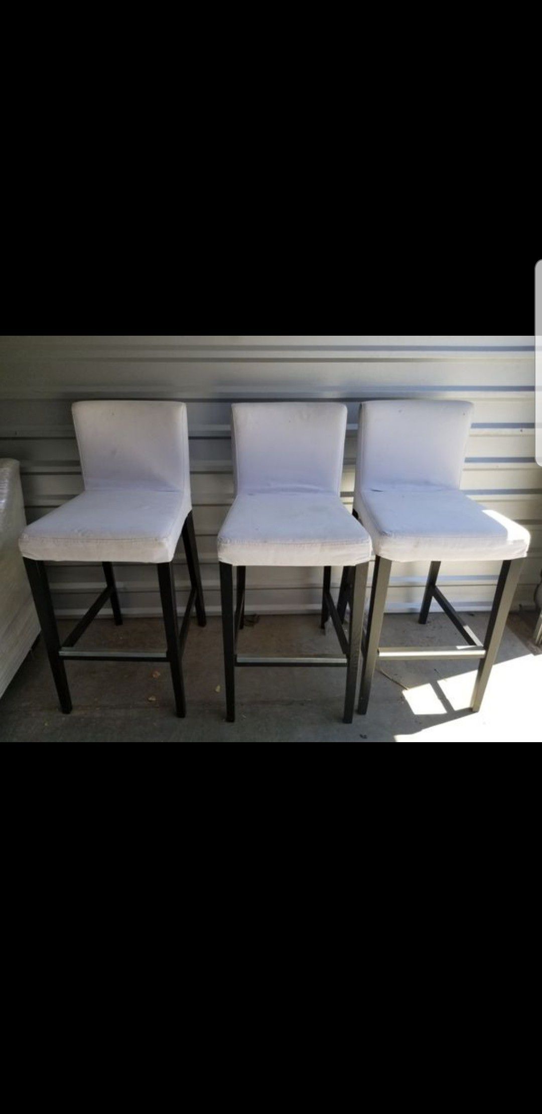 Three bar stool height chairs, comfortable, covers come off and can be washed. Asking $100