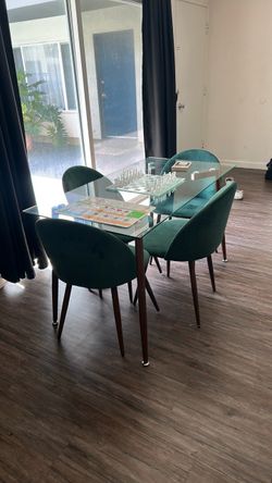 Glass dining room table, four chairs