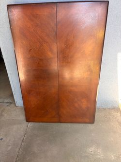 Wooden dining room table with chairs