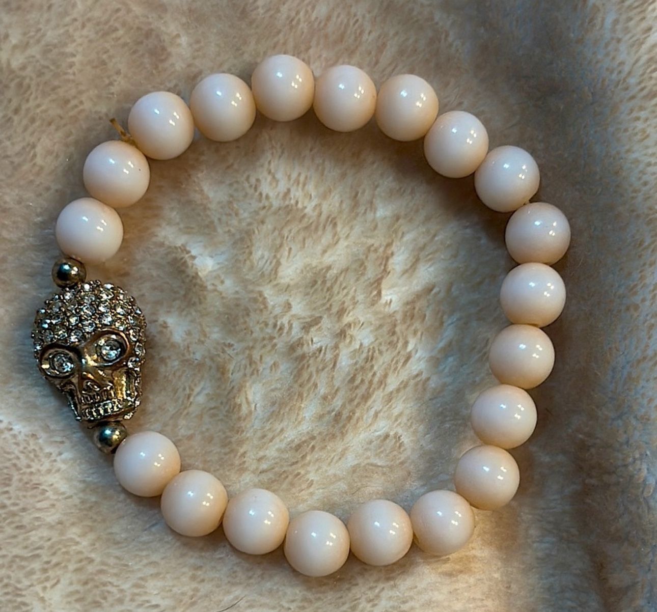 Light Pink Beaded Bracelet with Gold Skull Charm